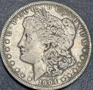 Dólar de plata Morgan 1904-P en estado bastante bueno detalles - Imagen 1 de 2