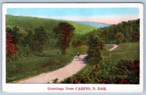 1920's GREETINGS FROM CARPIO NORTH DAKOTA ND HORSE BUGGY DIRT ROAD POSTCARD - Picture 1 of 2