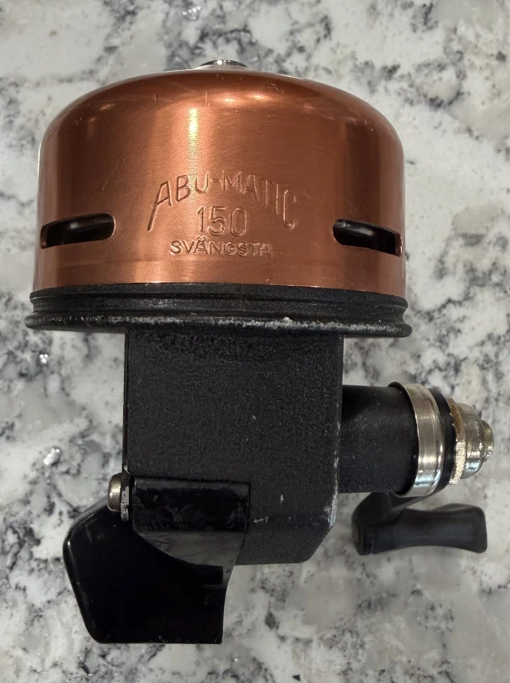 Carrete de pesca Abu Garcia Abu-Matic 150 spin fundido oro rosa, hecho en Suecia Foto 1 de 4