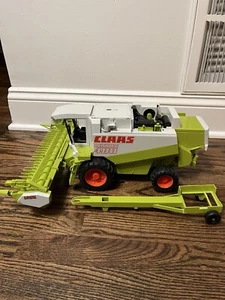 Bruder CLAAS Lexion 480 Combine Harvester with Mowing Attachment & Trailer 1:20 - Picture 1 of 17