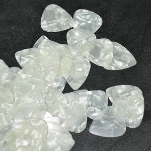 100 piezas/lote de 100 púas de guitarra en blanco delgadas de celuloide perla de 0,46 mm nuevas - Imagen 1 de 3