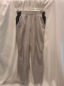 Pantalones deportivos #551 Reebok para niño talla Lg (10/12) grises con bolsillos negros y rojos - Imagen 1 de 7