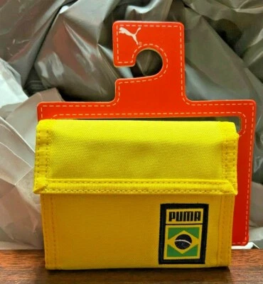 CARTERA OFICIAL DOBLE PLIEGUE COPA MUNDIAL PUMA BRASIL - AMARILLO VERDE Foto 1 de 3