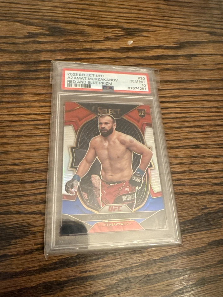 2023 Panini Select UFC — Concourse Азамат Мурзаканов No20 красно-синяя призма (RC) - Изображение 1 из 1