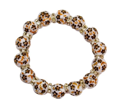 Pulsera elástica de cuentas de porcelana con flores marrones y blancas con cuentas de cristal - NUEVA Foto 1 de 4