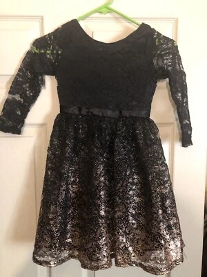 NIÑAS VESTIDO DE ENCAJE NEGRO Y DORADO RUBOR POR US ANGELS TALLA 7 Preloved Foto 1 de 4