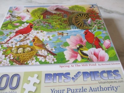 1,000 Piece Rosiland Solomon Art Puzzle- Spring at the Mill Pond  20" x 27" - Image 1 of 4