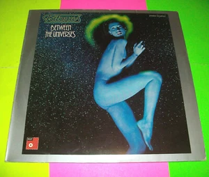 ⭐ TRITONUS - BETWEEN THE UNIVERSES VINYL LP 1976 BASF ⭐IMPORT GERMANY⭐ - Picture 1 of 2