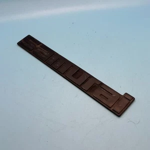 OEM 86-95 Suzuki Samurai Rear Tail Gate Emblem - Picture 1 of 2
