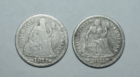 D11. 2X LIBERTY SEATED ONE DIME SILVER COINS = 1873 & 1874 BOTH WITH ARROWS Cover