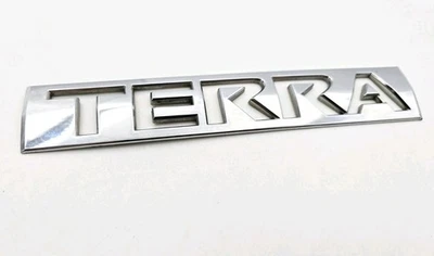 2005-2012 NISSAN XTERRA TERRA REAR EMBLEM LOGO BADGE SYMBOL OEM - Image 1 of 3