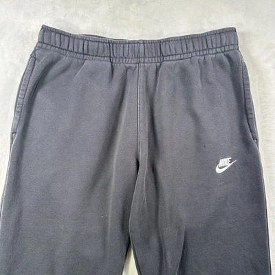Pantalones de chándal Nike negros descoloridos Swoosh con bolsillo a presión talla mediana Foto 1 de 4