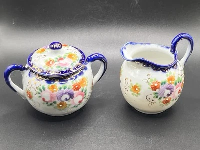 Azúcar y crema de porcelana pintada a mano de colección - azul cobalto con motivo floral Foto 1 de 4