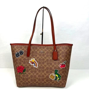 Coach City Tote Bag Signature Canvas Sticker Print Gold Tan Multi NWT CZ611 - Picture 1 of 11