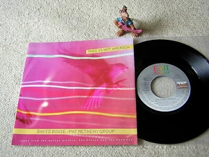 DAVID BOWIE / PAT METHENY GROUP This Is Not America 1985 EEC 7" + PS EMI AMERICA - Bild 1 von 1