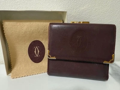 Cartera Cartier de cuero marrón oscuro triple pliegue logotipo en relieve usada Japón Foto 1 de 4