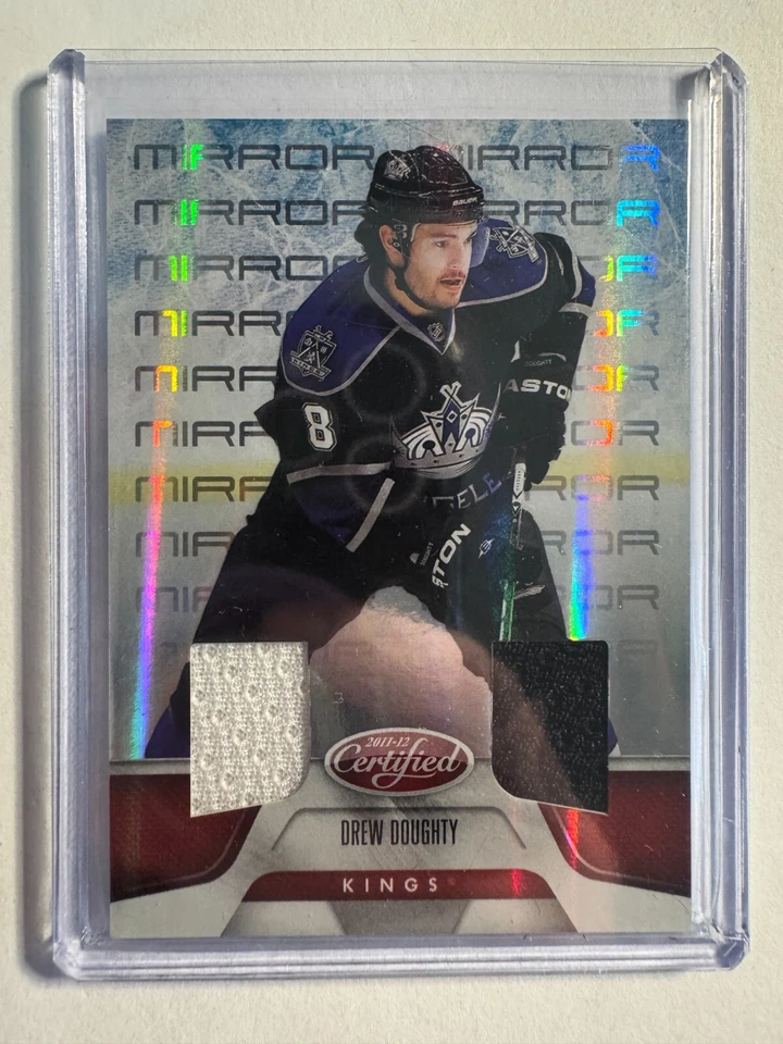 K315,946 - 2011-12 Certified Mirror Red Relics Dual #26 Drew Doughty #/150 - Image 1 of 1