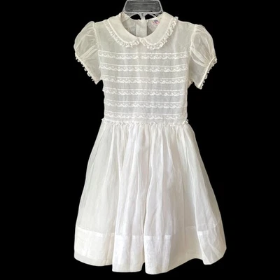 Vestido blanco de colección Miss Quality para niñas de nailon transparente encaje Peter Pan mangas abullonadas pequeño Foto 1 de 4