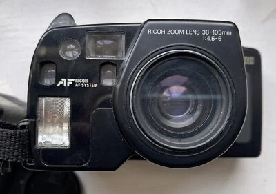 VINTAGE RICOH MIRRI 105 CAMERA RICOH ZOOM LENS 38-105MM 1:4.5-6 LENS+case & lens - Image 1 of 4