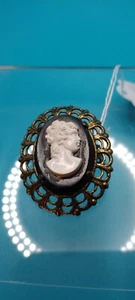Vintage Cameo with Goldtone Edging, a white portrait on a black background. - Picture 1 of 5