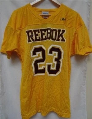 Camiseta deportiva Reebok niño grande dorada clara Foto 1 de 3