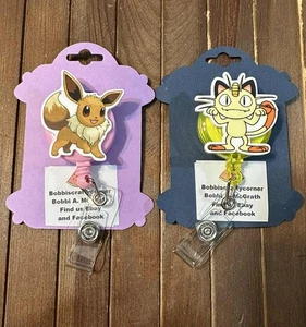 Eevee and Meowth badge reels - Picture 1 of 4
