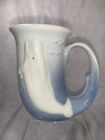 Horn shape blue glazed ceramic Alaska mug with raised white beluga whale 4.75 in