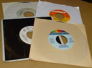 Four 45rpm Vinyl Records - Bruce Springsteen John Lennon Tom Petty Elton John - Imagen 1 de 3