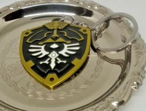 Zelda Keychain Nintendo Enamel Shield Design Black & Gold Collectible - Picture 1 of 3