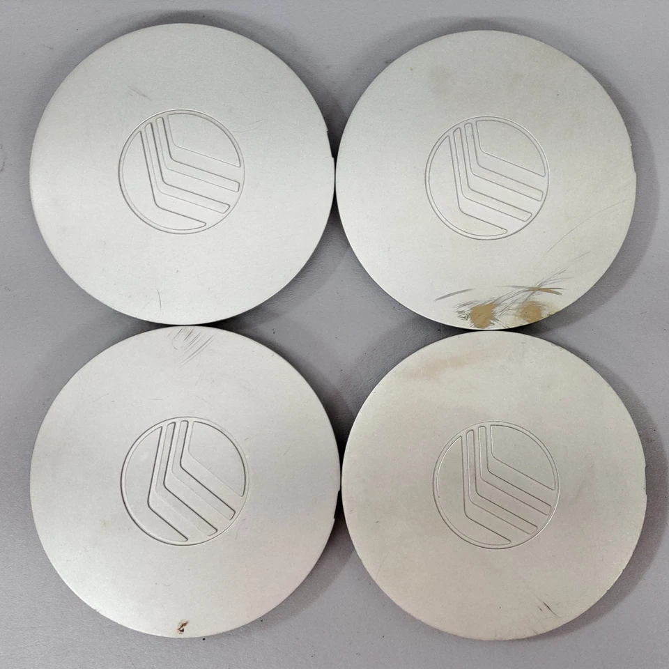 Juego de 4 tapacubos centrales de rueda plateados de fábrica 97-99 Mercury Tracer F7K6-1A096-AB Foto 1 de 4