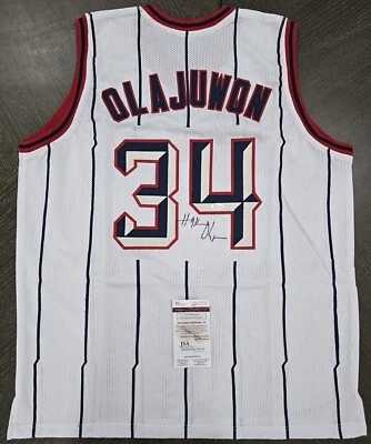 HAKEEM OLAJUWON SIGNED AUTO HOUSTON ROCKETS PINSTRIPE JERSEY JSA AUTOGRAPHED - Image 1 of 3
