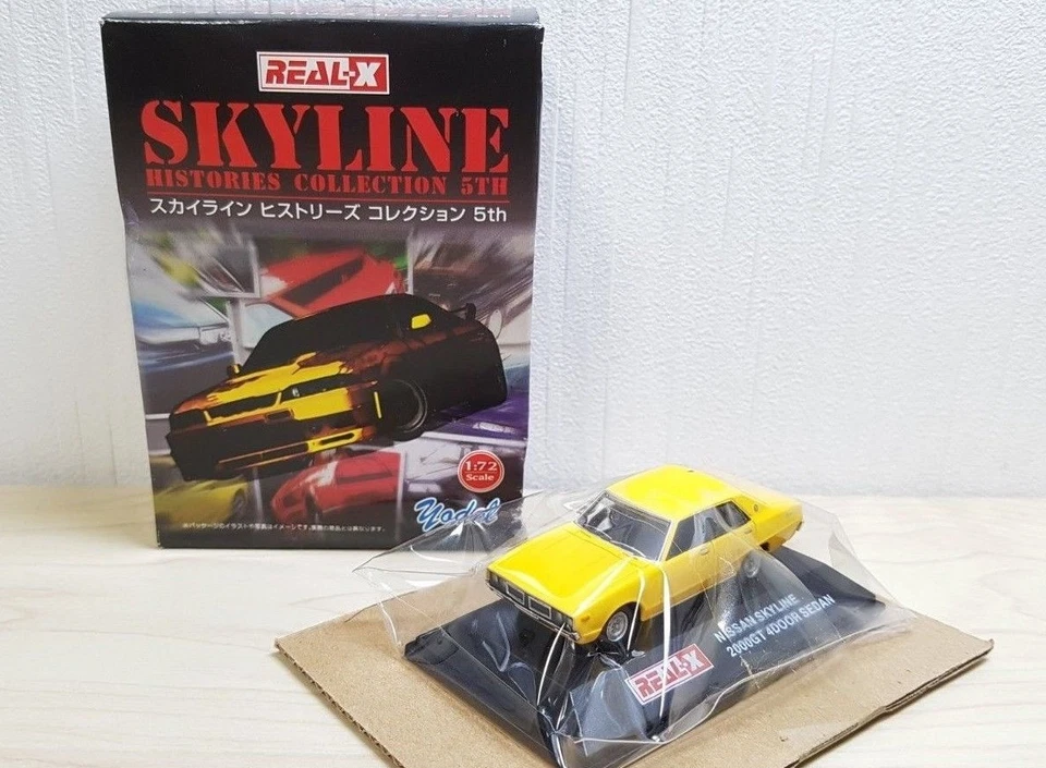 1/72 Real-X NISSAN SKYLINE 2000GT 4 DOOR SEDAN YELLOW diecast car model - Image 1 of 1