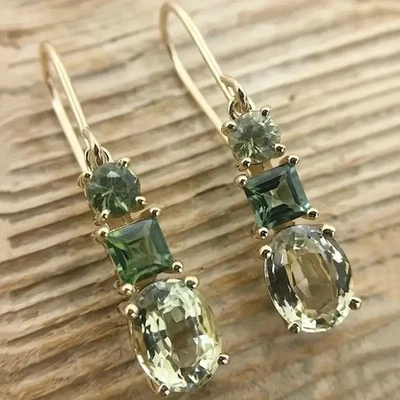 Hermosos pendientes colgantes de piedra de vidrio verde peridoto chapados en oro Foto 1 de 4