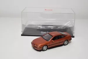 B27 1:43 SCHUCO OPEL CALIBRA MARRÓN METÁLICO COBRE NUEVO EN CAJA - Imagen 1 de 16