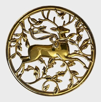 Footed Trivet with Reindeer and Holly Leaves 6.5” In Diameter Gold - Image 1 of 4