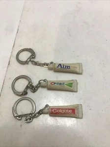Lot of 3 Vintage Rare Toothpaste Souvenir Keychains-Aim-Crest-Colgate ￼ Promo￼ - Picture 1 of 2