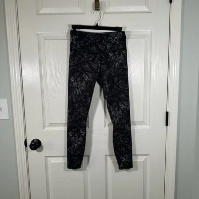 Leggings pequeños para mujer Spider Active negros con diseño blanco Foto 1 de 4