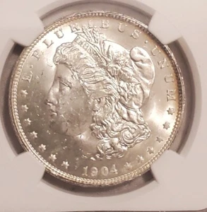 1904 O Morgan Silver Dollar MS 63 NGC New Orleans Mint Bright White Reflective - Picture 1 of 6