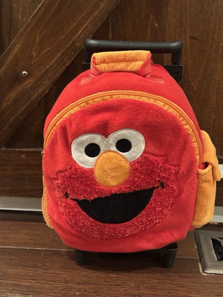 Mochila de pelúcia Sesame Street Elmo carrinho feliz sobre rodas animal aventura pequena - Imagem 1 de 4