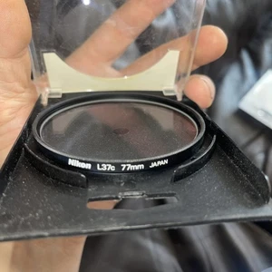 Nikon L37c 77mm UV Filter. Mint. Tatty case - Picture 1 of 2