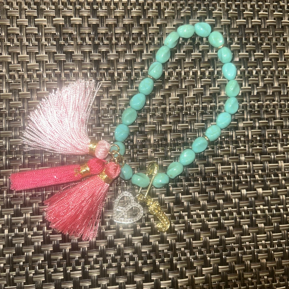 Juicy Couture Turquoise Bead Pink Tassel Safety Pin Charm Stretch Bracelet - Image 1 of 4