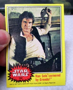 1977 Star Wars tarjeta coleccionable serie amarilla #162 Han Solo acorralado por Greedo - Imagen 1 de 2