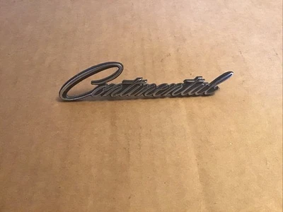 1972-75 Lincoln Continental Headlight Door Emblem OEM - Image 1 of 2