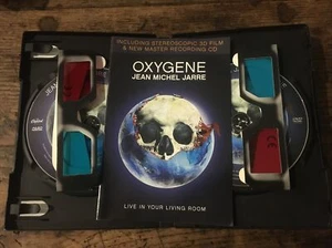 OXYGÈNE … JEAN MICHEL JARRE ... Coffret ( DVD + CD + LUNETTES 3 D ) - Foto 1 di 3