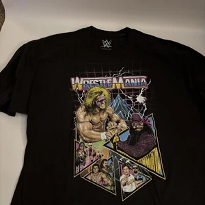 T-shirt WWE Wrestlemania VI uomo nera taglia 3XL. Ultimate Warrior Macho Man - Foto 1 di 3