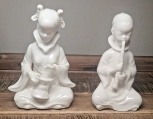Dos estatuillas de porcelana de músico asiático niña con tambor con flauta/clarinete - Imagen 1 de 11