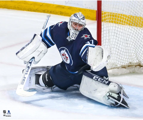 Connor Hellebuyck Winnipeg Jets Unsigned Blue Jersey Glove Save Photo Cover