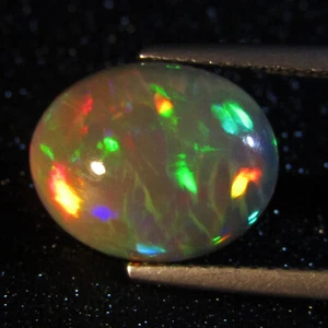3.68Cts Natural Color Play Unheated Ethiopia White Opal Oval Gemstone REF VIDEO - Picture 1 of 3