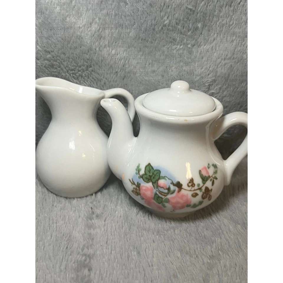 Conjunto miniatura de bule e creme de cerâmica branca design floral rosa - Imagem 1 de 4