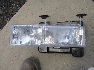 90-98 Chevy C1500 LH Headlamp New A/M w/Bracket - Picture 1 of 5